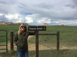 Diane Brooks posing near Pawnee Buttes